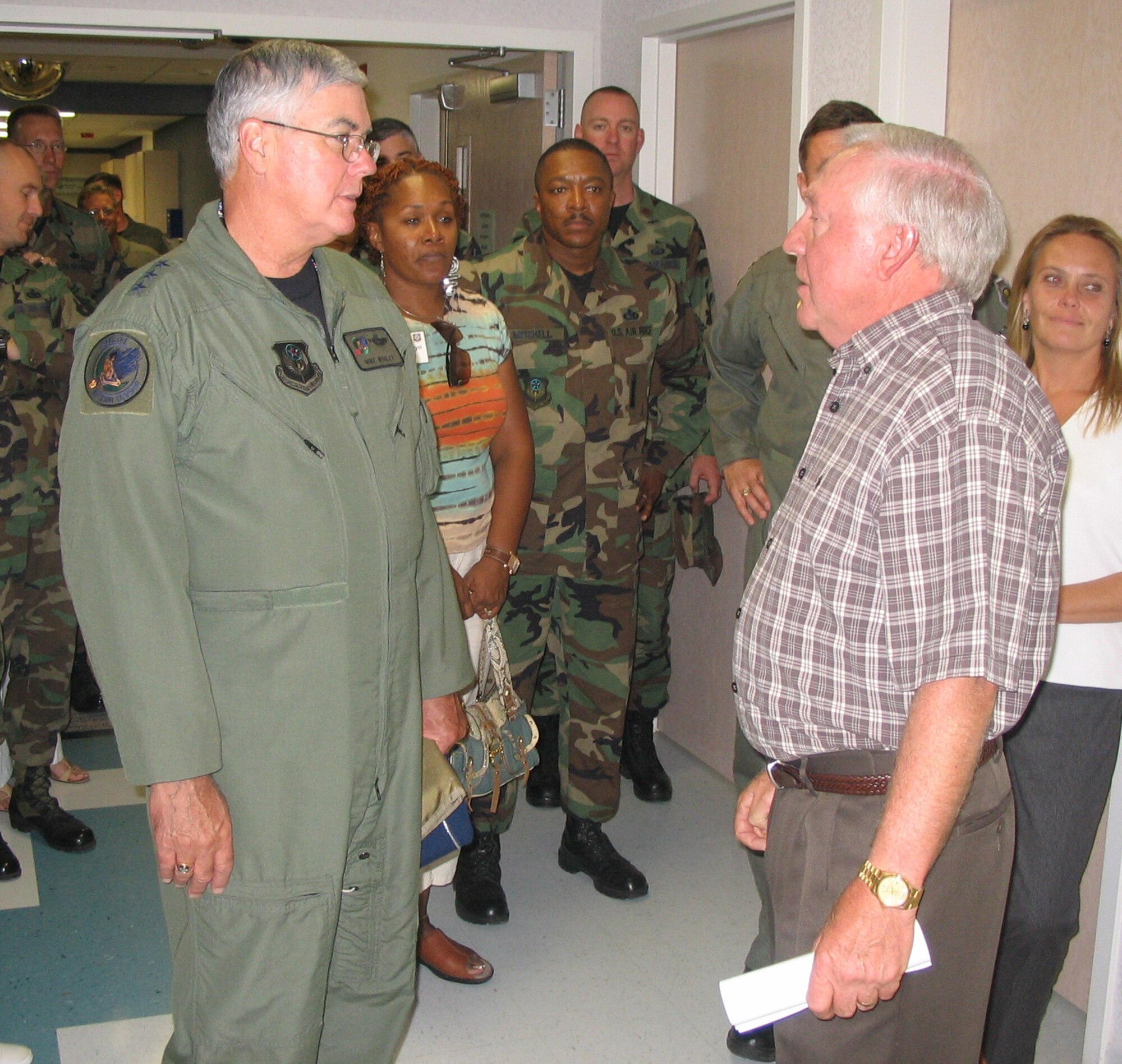 Lt. Gen. Michael Wooley, (left) Air Force Special Operations Command commander, speaks with James D'Agastino, Roosevelt General Hospital chief executive officer administrator, about the services the facility provides to residents during the group's visit to Portales, N.M.  The 12,000-person city is approximately 12 miles from Cannon Air Force Base.  (U.S. Air Force Photograph by Lt. Amy Cooper)