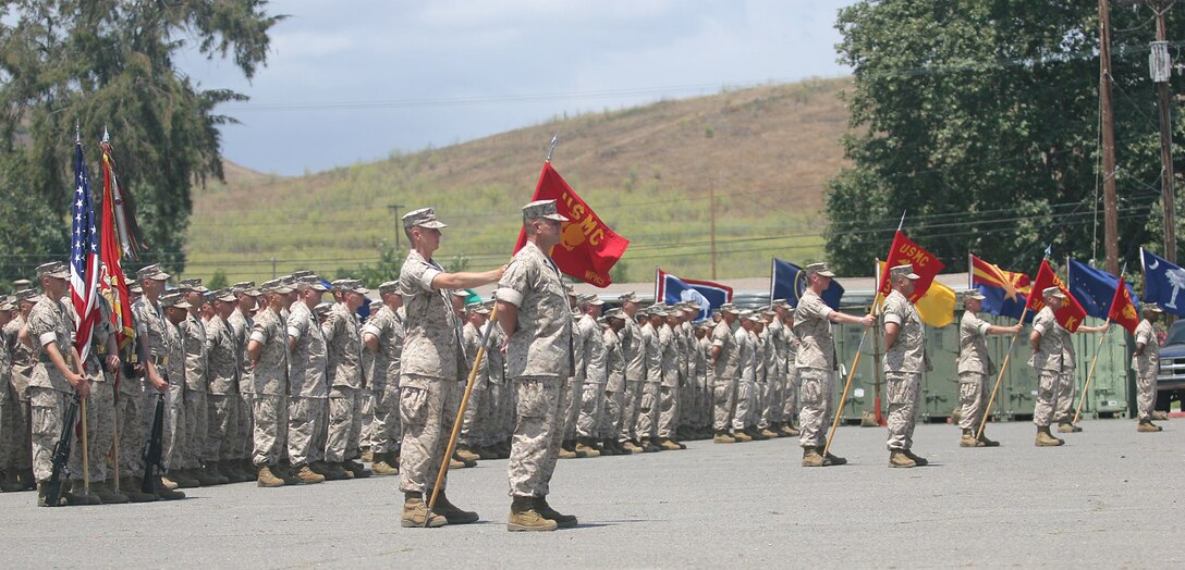 Marines from the 3rd Battalion, 1st Marine Regiment, 1st Marine Division, stand in formation awaiting the presentation of the Navy Cross medal to former Marine Sgt. Robert J. Mitchell during a ceremony aboard Camp Pendleton, Calif., July 28, 2006.  Mitchell earned the award for his heroism during the battle for Fallujah, Iraq in November 2004.