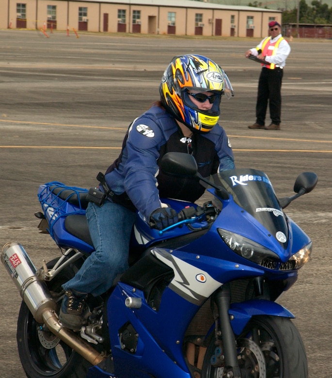 Petty Officer 1st Class Charlene Carter, a torpedos mate aboard the USS Chafee, participated in the slalom event during the 2006 Motorcycle Rodeo held at Wheeler Army Air Field, July 28. The event tested riders maneuverability while making sharp turns and sudden stops.