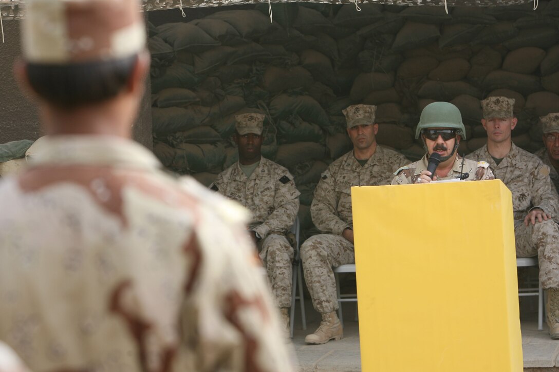 Col. Khalid, commander for 2nd Battalion, 1st Brigade, 7th Iraqi Army gives a speech during the official turn over Forward Operating Base Snake Pit in Ar Ramadi July 31.  Marines from 3rd Battalion, 8th Marine Regiment handed over control of FOB Snake Pit and surrounding battlespace to the Iraqi Army during a Transfer of Authority ceremony. 3/8 is currently deployed with I MEF (FWD) in support of Operation Iraqi Freedom in the Al Anbar province of Iraq (MNF-W) to develop the Iraqi Security Forces, facilitate the development of official rule of law through demographic government reforms, and continue the development of a market based economy centered on Iraqi reconstruction.   USMC photo by Cpl. Joseph DiGirolamo  060731-M-0008D-009