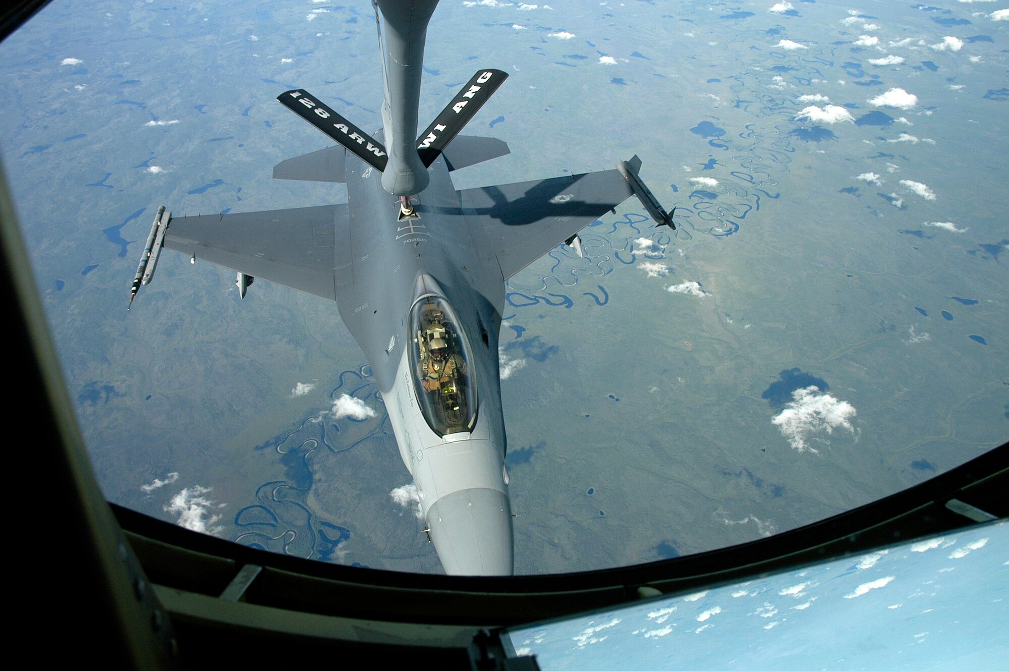 EIELSON AFB, Alaska -- 128th Air Refueling Wing from Milwaukee, Wisconsin refuel an F-16C from Hill AFB, Utah during CCT -06.  Photo by 1st Lt. Peter Liander, Swedish Air Force                                