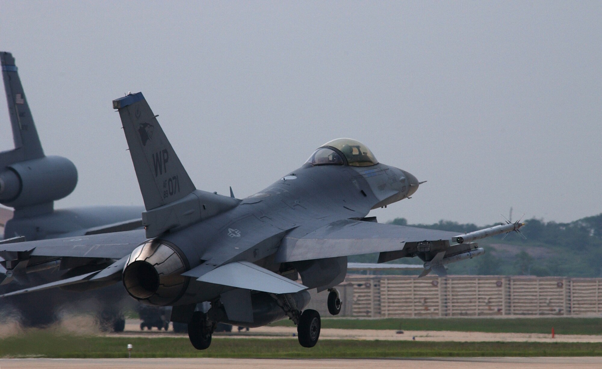 KUNSAN AIR BASE, Republic of Korea - An F-16 assigned to the 35th Fighter Squadron lifts off from Kunsan May 26 on its way to Paya Lebar Air Base, Singapore. The ?Panton? jet fighter was joined by approximately five additional aircraft, as well as roughly 80 pilots and maintenance personnel, in its deployment to the island nation in support of Operation Commando Sling. The joint operation between the air forces is in its 16th year. (Air Force photo by Senior Airman Joshua DeMotts)                               
