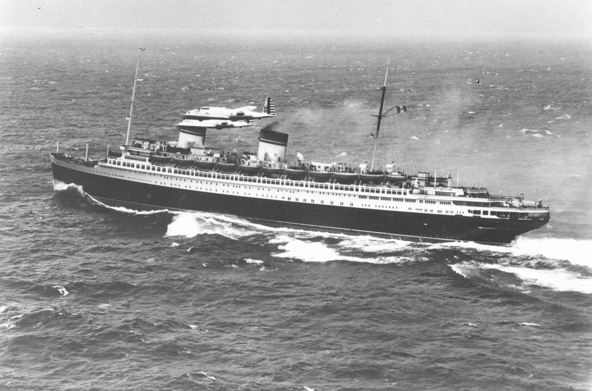 Boeing Y1B-17 fly-by near the Italian liner "Rex," about 800 miles east of New York City. (U.S. Air Force photo)