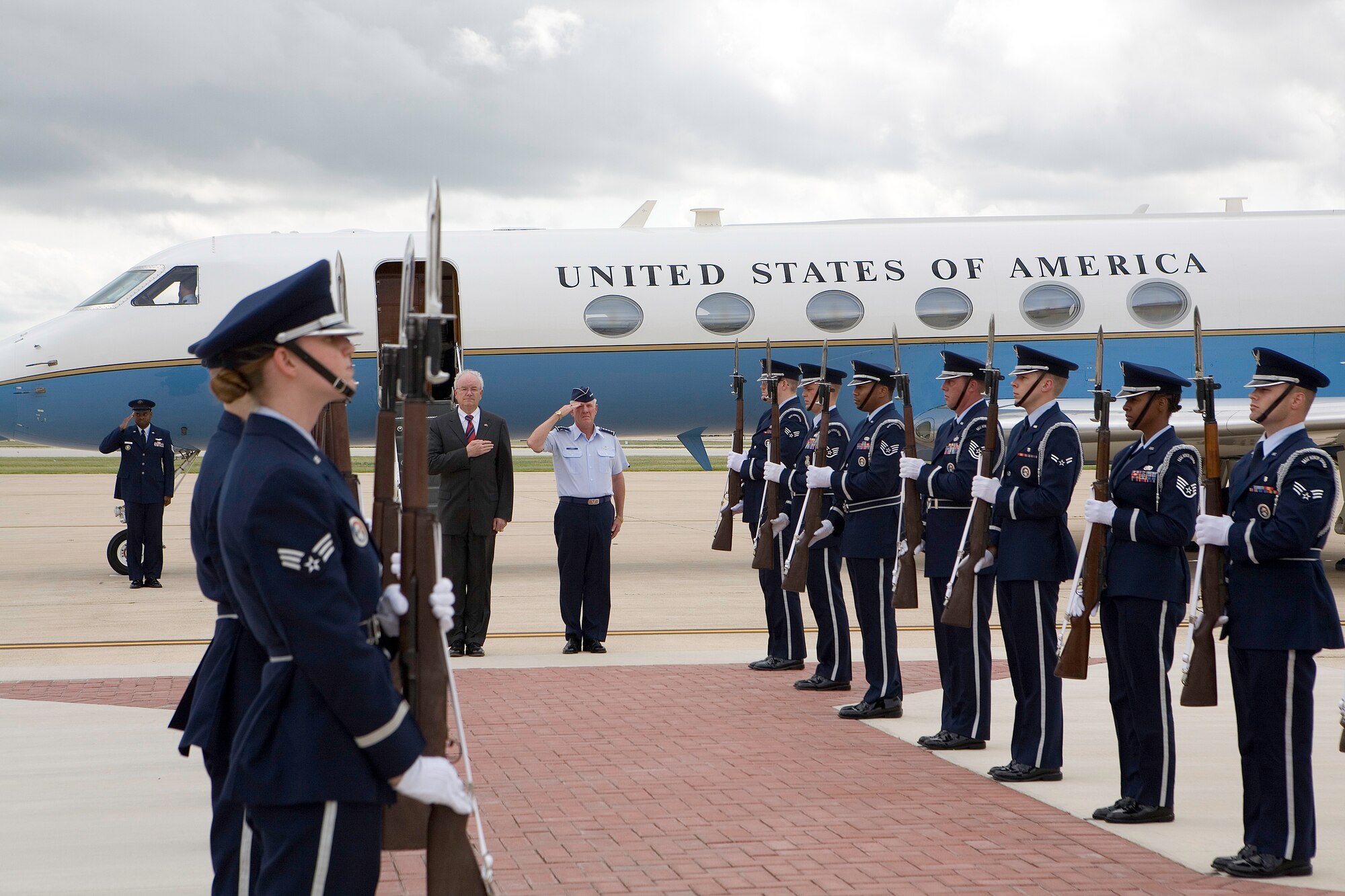 Secretary of the Air Force Michael W. Wynne and Gen. William "Bill" Looney stand at attention during an arrival ceremony for the secretary at Lackland Air Force Base, Texas, on Wednesday, May 31, 2006. During his visit, Secretary Wynne will review the basic military training parade and administer the oath of enlistment to graduates, and view other training sites at the base. General Looney is commander of Air Education and Training Command. (U.S. Air Force photo/Tech. Sgt. Mark Borosch)
