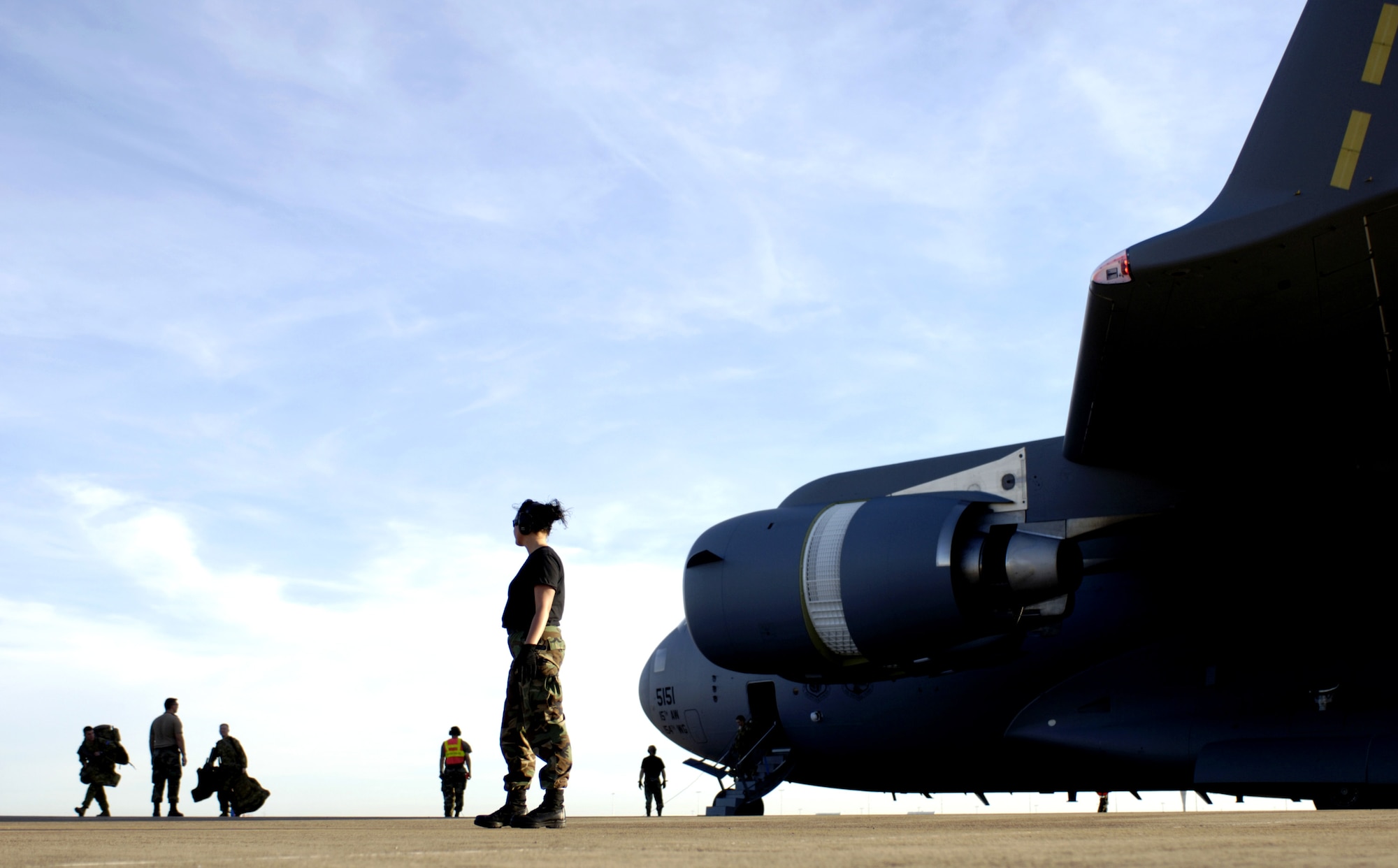 Staff Sgt. Liselle Bracey watches as Australian Defense Force members leave a C-17 Globemaster III at Darwin, Australia, on Thursday, June 1, 2006. Sergeant Bracey is with the 15th Logistics Readiness Squadron at Hickam Air Force Base, Hawaii. Two C-17s from Hickam are helping the Australian Defense Force reposition its forces to better support peace operations in East Timor. (U.S. Air Force photo/Tech. Sgt. Shane A. Cuomo) 
