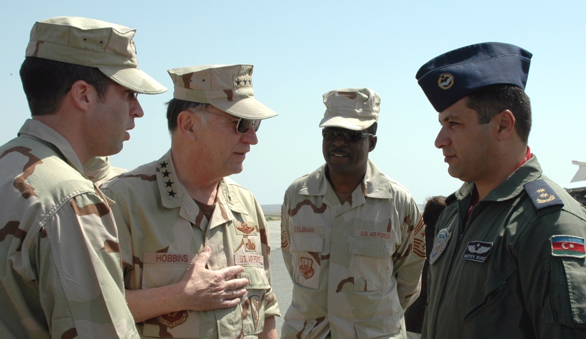 NASOSNAYA AIR BASE, Azerbaijan – Gen. Tom Hobbins, U.S. Air Forces in Europe commander, and Chief Master Sgt. Gary Coleman, USAFE command chief, are greeted by Lt. Col. Elmer Huseyov, Azerbaijani Air Force, during their May 19 visit to Nasosnaya Air Base, Azerbaijan. The purpose of the visit was to open relations with Azerbaijani leadership and to check the progress of a runway surveyed by the 16th Air Force team a month earlier. The group exchanged ideas to modernize the runway to place it in NATO standards for potential future use by the United States.  

 
