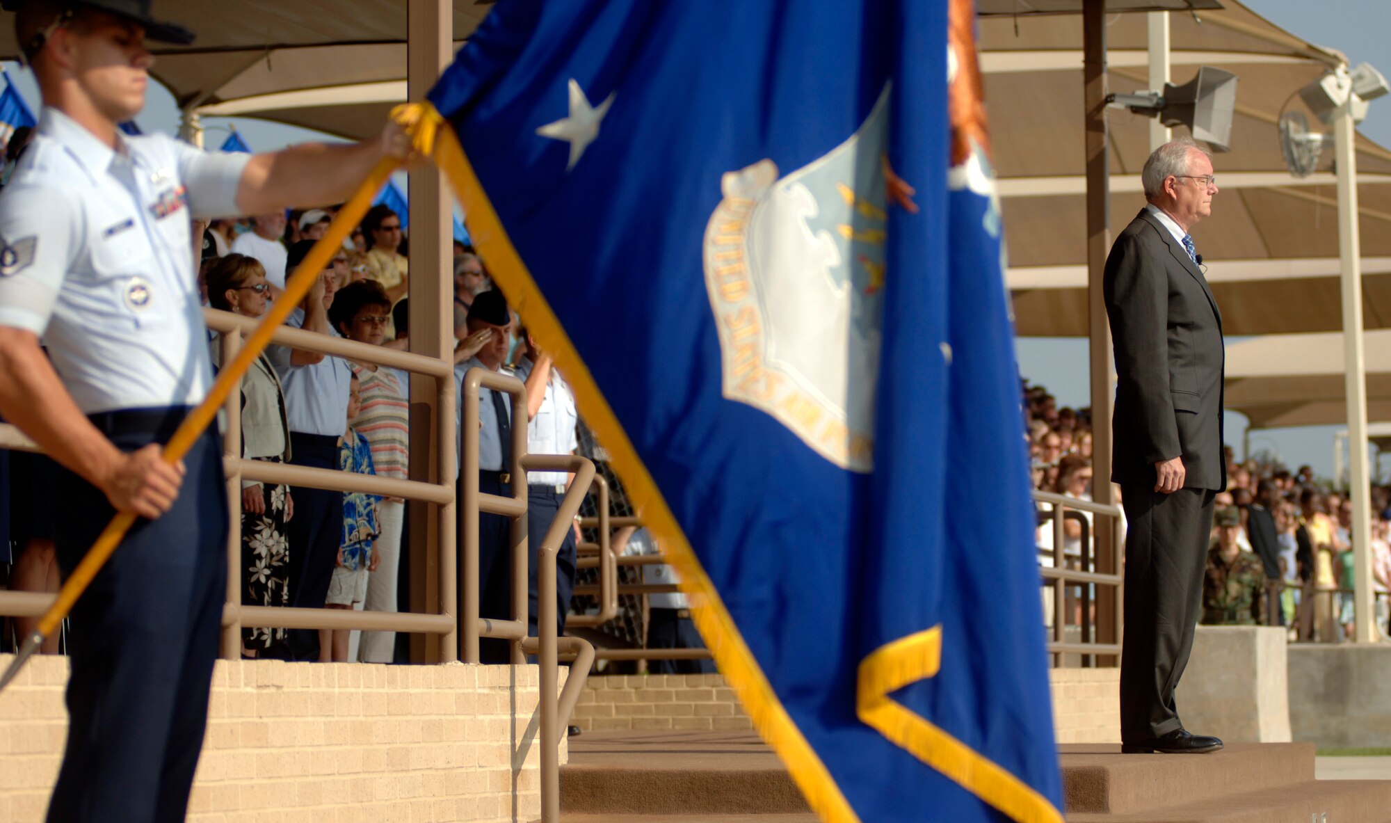 Secretary of the Air Force Michael W. Wynne presides over the basic military training parade as training flights march by on graduation day at Lackland Air Force Base, Texas, on Friday, June 2, 2006. Secretary Wynne was in San Antonio visiting various military installations and training sites. (U.S. Air Force photo/Tech. Sgt. Cecilio M. Ricardo Jr.)