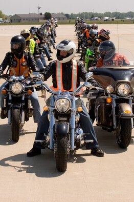Base motorcycle riders await clearance from the air traffic control tower to begin their group ride down the Dover Air Force Base flightline May 3. The group ride was scheduled as a part of the wing's Motorcycle Safety Day, sponsored by the 436th Airlift Wing Safety Office. (U.S. Air Force Photo by Doug Curran)