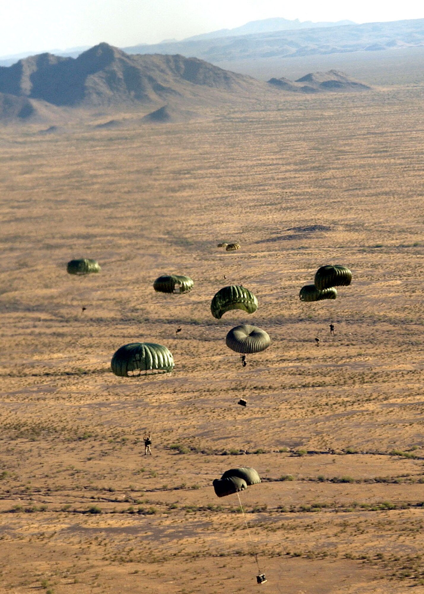 Pararescuemen from the 48th Rescue Squadron at Davis-Monthan Air Force Base, Ariz., jump over Gila Bend Auxiliary Air Field, Ariz., during a major accident response exercise on Tuesday, May 30, 2006.  The scenario involved a simulated plane crash with 20 survivors. (U.S. Air Force photo/Airman Alesia Goosic)

