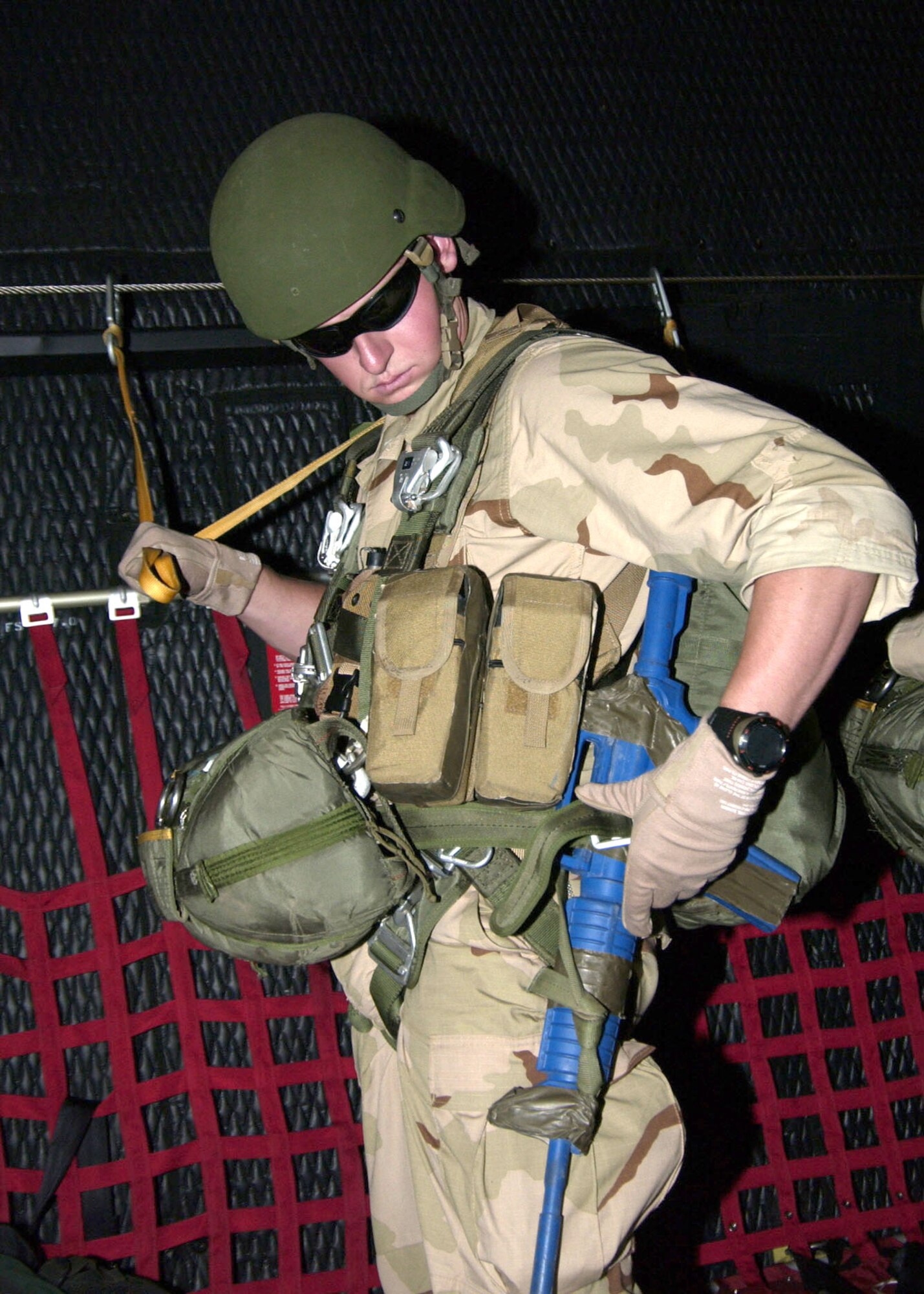 Senior Airman Brent McAllister checks equipment on board a C-130 Hercules while participating in a major accident response exercise at Gila Bend Auxiliary Air Field, Ariz., on Tuesday, May 30, 2006. The scenario involved a simulated plane crash with 20 survivors and was part of a major accident response exercise. Airman McAllister is a pararescueman with the 48th Rescue Squadron at Davis-Monthan Air Force Base, Ariz. (U.S. Air Force photo/Airman Alesia Goosic)