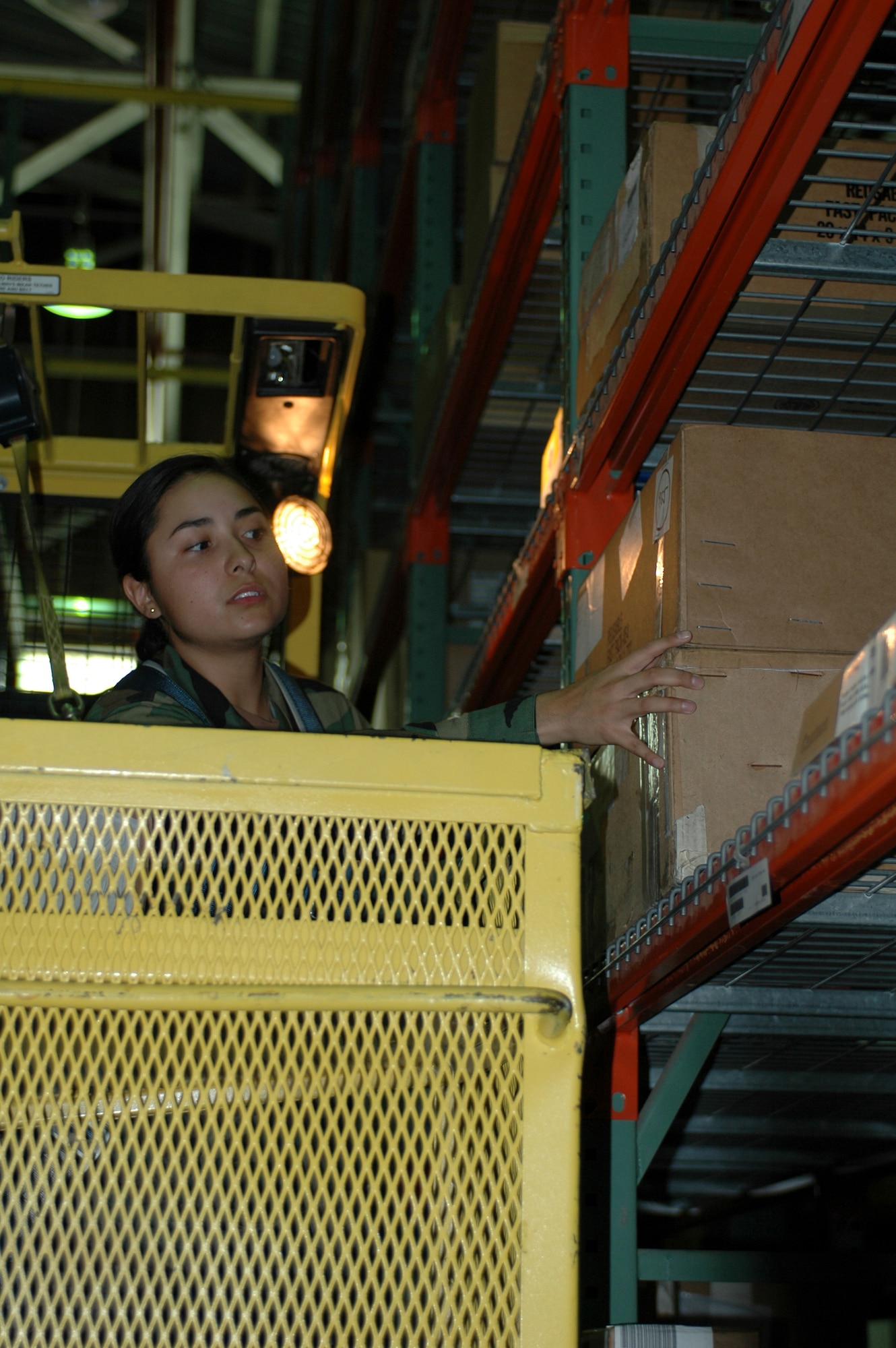 Airman 1st Class Jazmin Gonzalez, aircraft parts store technicians, uses a hyster to put parts away in the warehouse. The Aircraft Parts store has gotten more than 11,800 C-17 parts from the Defense Logistics Agency and 15,976 parts from Boeing. (U.S. Air Force photo by Jennifer Brugman)