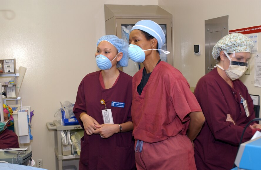 Senior Airman Tina Willoughby, surgical technician, gives Chief Master Sgt. Carol Johnson, 60th Air Mobility Wing interim command chief, a tour of the David Grant USAF Medical Center operating room. (U.S. Air Force photo by Andre Mansour)