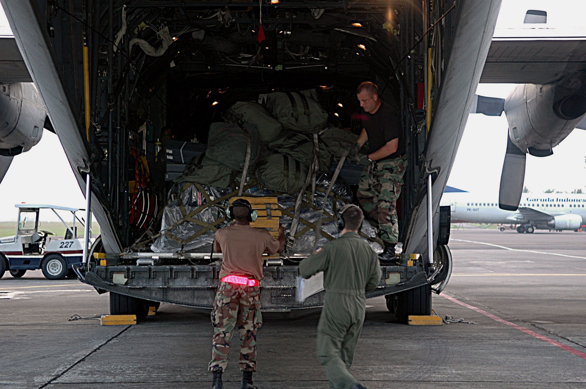 Airmen from the 36th Airlift Squadron and Combat Mobility Element at Yokota Air Base, Japan, unload supplies and equipment at Yogyakarta, Indonesia, on Thursday, June 1, 2006. The C-130 Hercules mission brought humanitarian relief aid to Indonesia, after an earthquake claimed the lives of more than 6,200 people and injured thousands more. (U.S. Air Force photo/Airman 1st Class Javier Cruz Jr.) 
