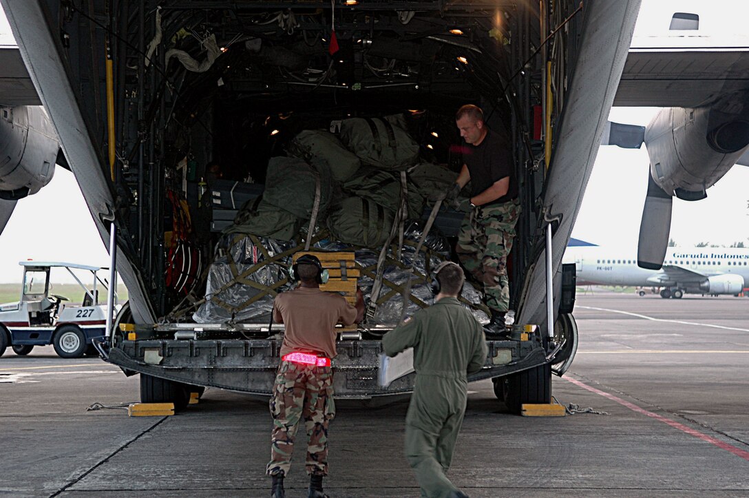 Airmen from Yokota Air Base, Japan, unload supplies and equipment at Yogyakarta, Indonesia, on Thursday, June 1, 2006. The C-130 Hercules mission brought humanitarian relief to Indonesia after an earthquake claimed the lives of more than 6,200 people and injured thousands more. (U.S. Air Force photo/Airman 1st Class Javier Cruz Jr.)
