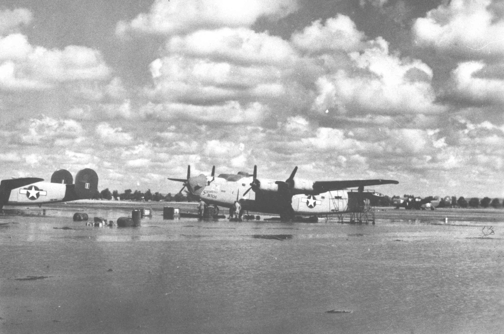 Consolidated B-24D "Strawberry Bitch" at the 58th Service Squadron depot (c. October 1943). Note the vertical stabilizers have been removed. (U.S. Air Force photo)