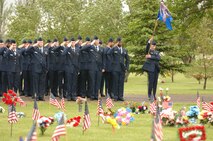 Airmen from the 5th CommunicationSquadron render salutes to fallen veterans during a Memorial Day tribute at Rosehill Memorial Park in the city of Minot May 29. (U.S. Air Force photo by Staff Sgt. Joe Laws)