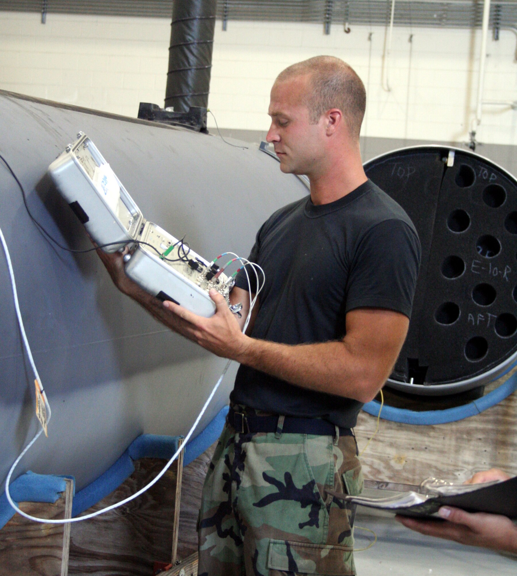 Senior Airmen Jarrod Snesko, 16th CMS, checks the gauges on AC-130U