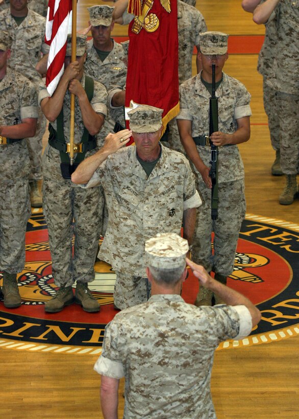 Col. Kenneth F. McKenzie salutes Lt. Gen. James F. Amos, II Marine Expeditionary Force Commanding General, during the 22nd Marine Expeditionary Unit's change of command ceremony held in Goettge Memorial Field House June 2, 2006.  McKenzie relinquished command of the MEU to Col. Douglas Stilwell.