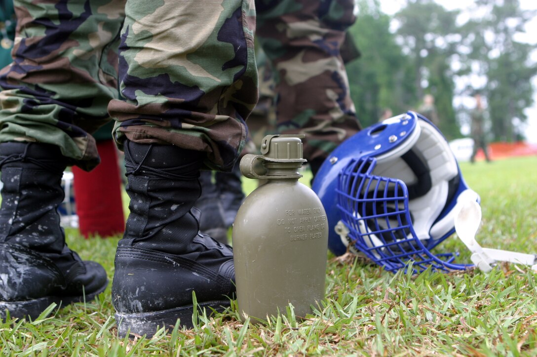 MARINE CORPS BASE CAMP LEJEUNE, N.C. (June 5, 2006) ? A canteen stands next to the feet of  Naval Reserve Officer Training Corps student here June 5. A select few Naval Reserve Officer Training Corps college students, they will spend sometime in the swamp-lands of humid North Carolina getting a taste of what it?s like to be a Marine and are demonstrated Marine Corps Martial Arts by the Marines of 2nd Marine Logistics Group.