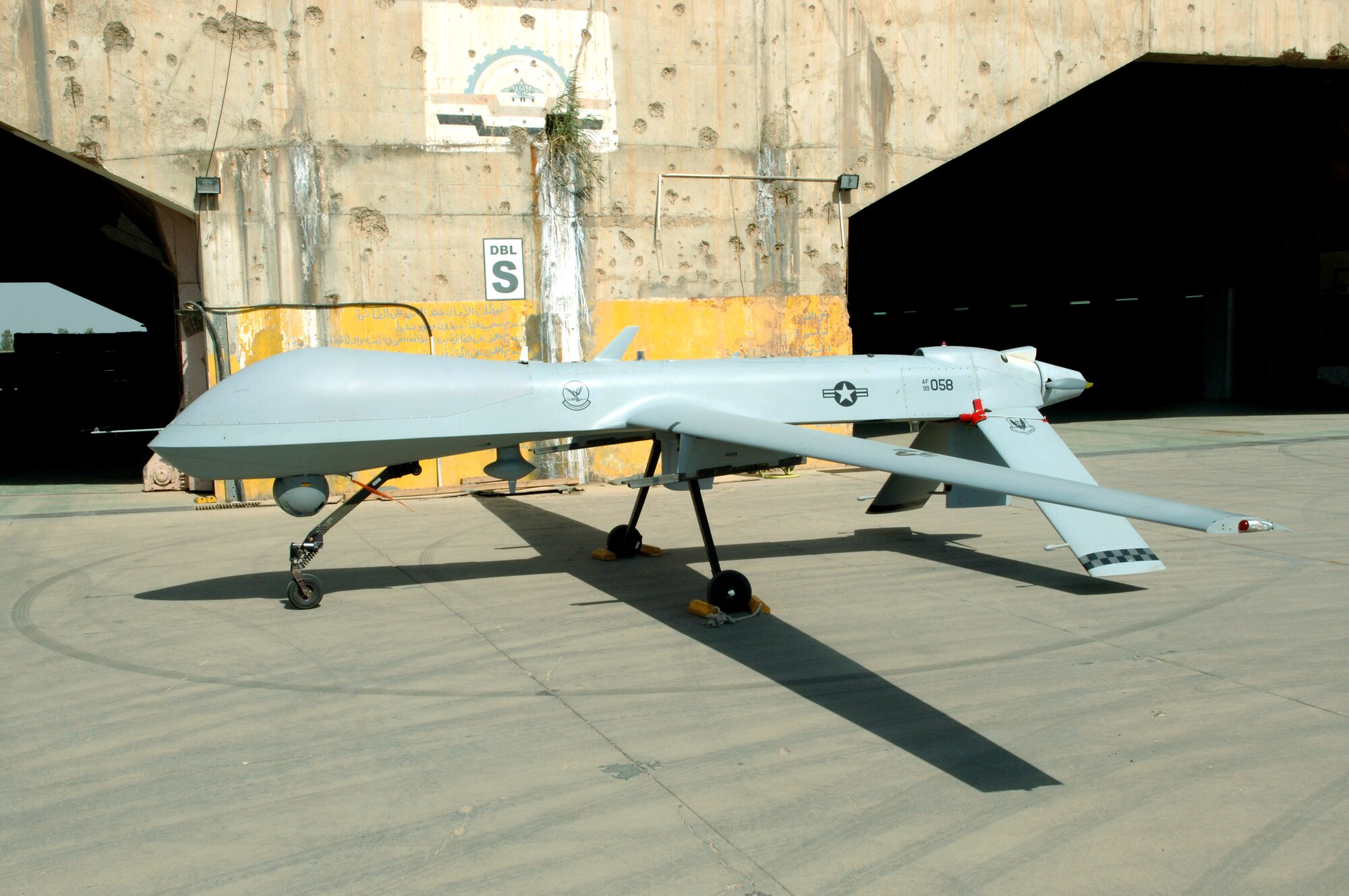 An MQ-1 Predator unmanned aerial vehicle sits on the parking ramp at Balad Air Base, Iraq. The Predator is a medium-altitude, long endurance, remotely piloted aircraft. Its primary mission is interdiction and conducting armed reconnaissance against critical, perishable targets. (U.S. Air Force photo/Staff Sgt. Tony R. Tolley) 
