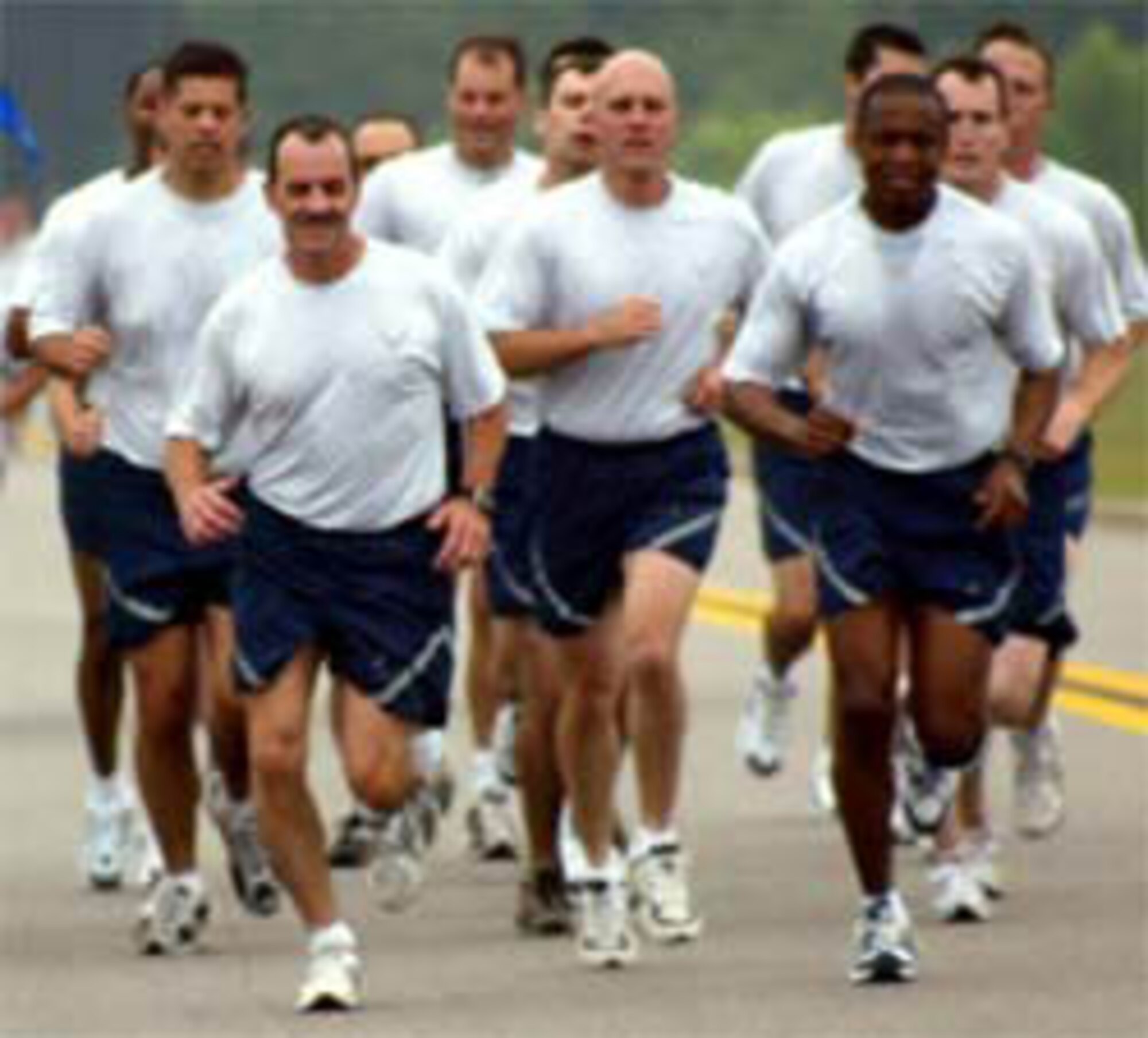 Command Chief Master Sgt. Herb Hanson and Brig. Gen. Darren McDew lead the pack as Team Pope returns from a formation run that kicked off Wingman Day May 25.