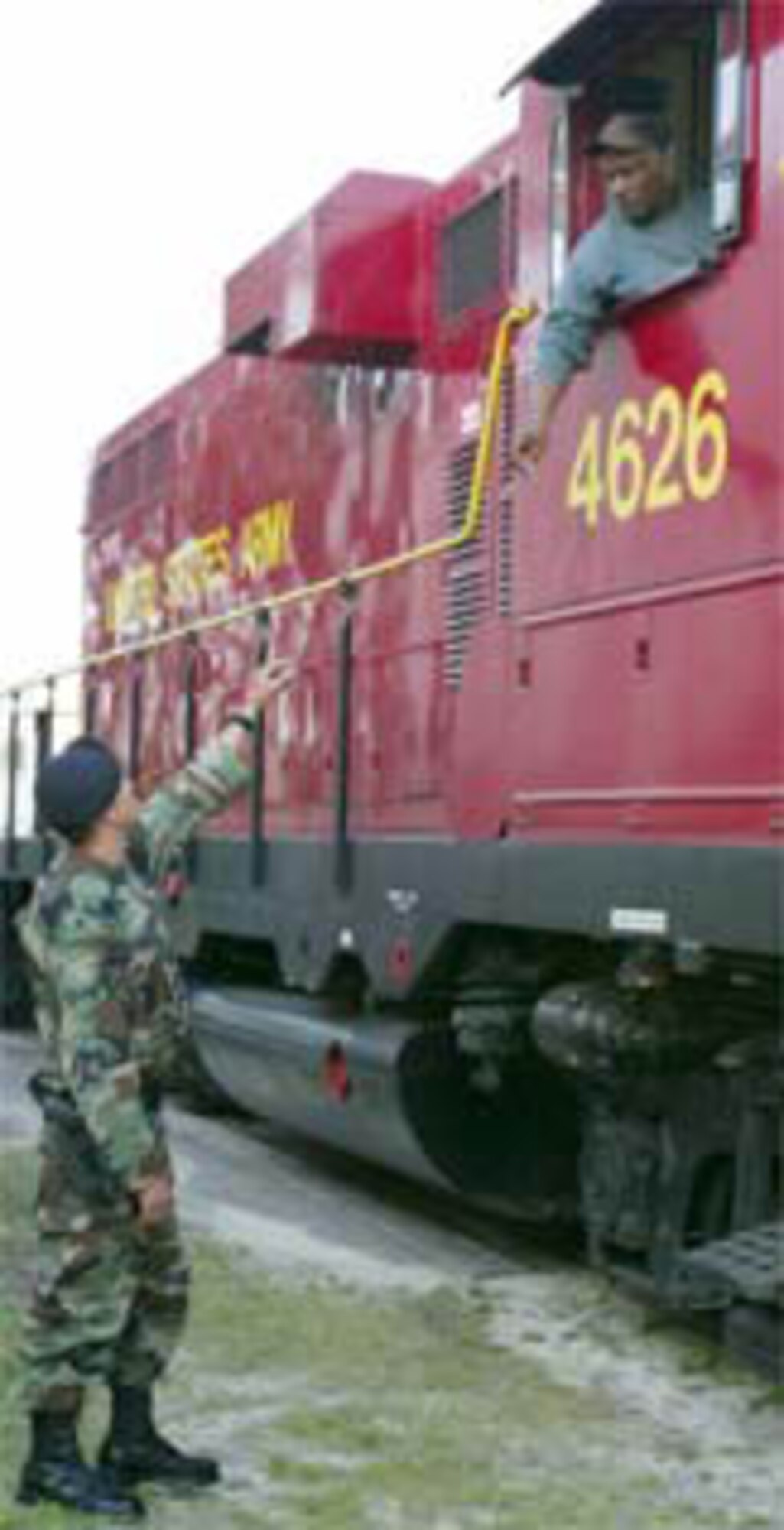A member of the 43rd Security Forces Squadron asks to check the identification of the train engineer. The Airman checked the entire train for possible hazards.