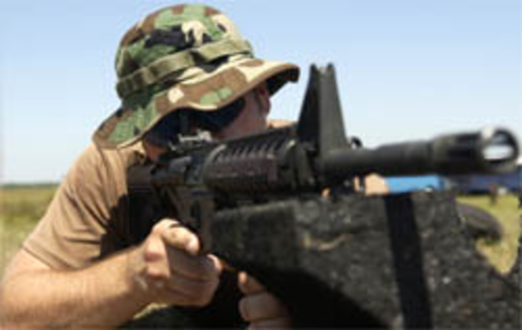US Air Force Senior Airman Brian Gee, 15th Air Support Squadron Fort Stewart GA, sites in hiw weapon before the shooting compation at Dragon Challenge, Avon Park, FL. May 20, 2006.   Dragon Challenge is a 18th Air Support Operations Group competition the challenges battlefield Airman both mentally and physically and helps prepare them and test their skills for the stresses of combat.  (US Air Force Photo by Tech Sgt. Jeromy K. Cross) 