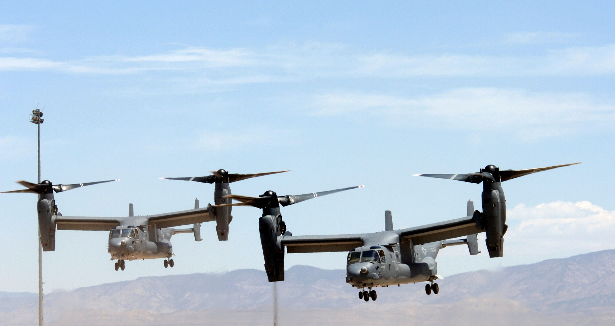 Two Air Force CV-22 Ospreys prepare to land at Holloman Air Force Base, N.M., on Friday, May 26, 2006. These Osprey are two of only three in the Air Force inventory. The Ospreys and their crews are taking part in the filming of the movie, "Transformers." (U.S. Air Force photo/Airman 1st Class Russell Scalf)
