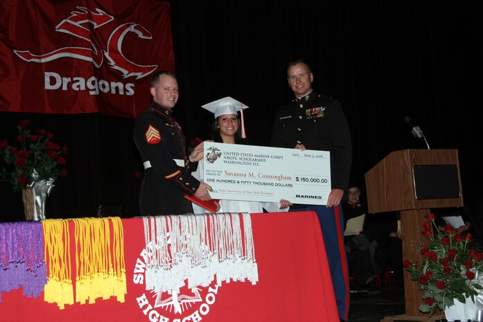 Capt. Elgin Young, RS Lansing's Operations Officer, and Sgt. Eric Snow present Savanna M. Cunningham with the Distinguished Athlete award and the NROTC scholarship May 15, 2007 at Swartz Creek High School.