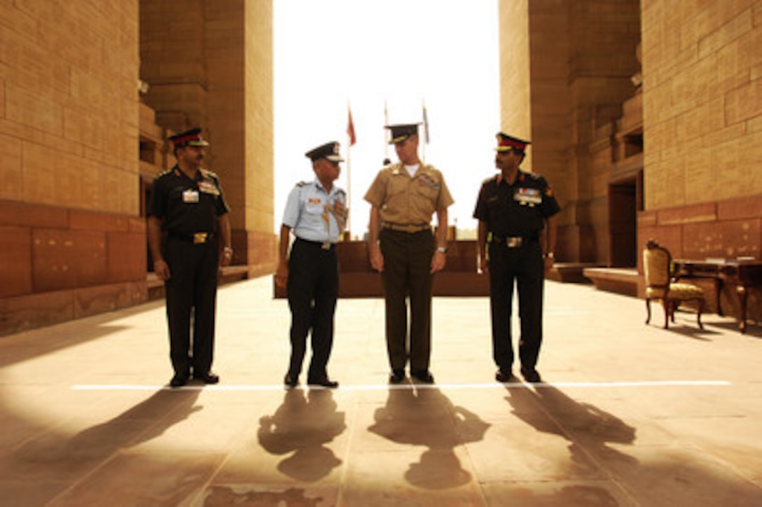 Chairman of the Joint Chiefs of Staff Gen. Peter Pace (center), U.S. Marine Corps, and senior Indian military officers pause after a wreath-laying ceremony at the India Gate in New Delhi, India, on June 5, 2006. India Gate is a monument built to commemorate the Indian soldiers who died in World War I and the Afghan Wars and contains the Amar Jawan Jyoti, the flame of the immortal warrior which marks the Unknown Soldier's Tomb. 