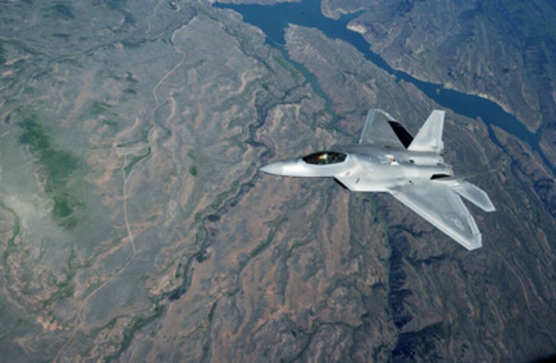 A U.S. Air Force F-22A Raptor aircraft flies over Colorado after in-flight refueling by a KC-135R Stratotanker aircraft from the 336th Air Refueling Squadron on May 30, 2006. The Raptor is attached to the 53rd Test and Evaluation Group. 