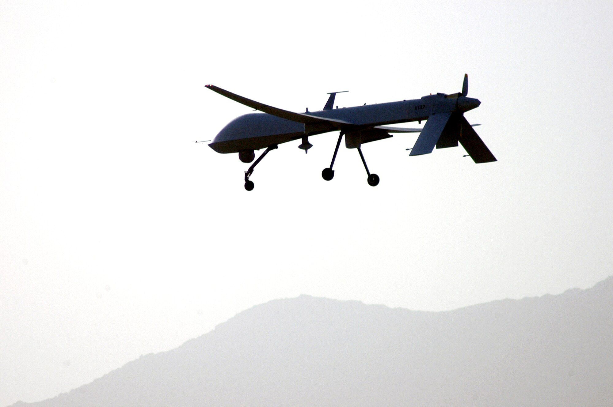 An Air Force MQ-1 Predator prepares to land Kandahar Airfield, Afghanistan, on Friday, June 2, 2006. The 62nd Expeditionary Reconnaissance Flight provides the launch and recovery element for all Predator missions in support of Operation Enduring Freedom. (U.S. Air Force photo/Maj. David Kurle)