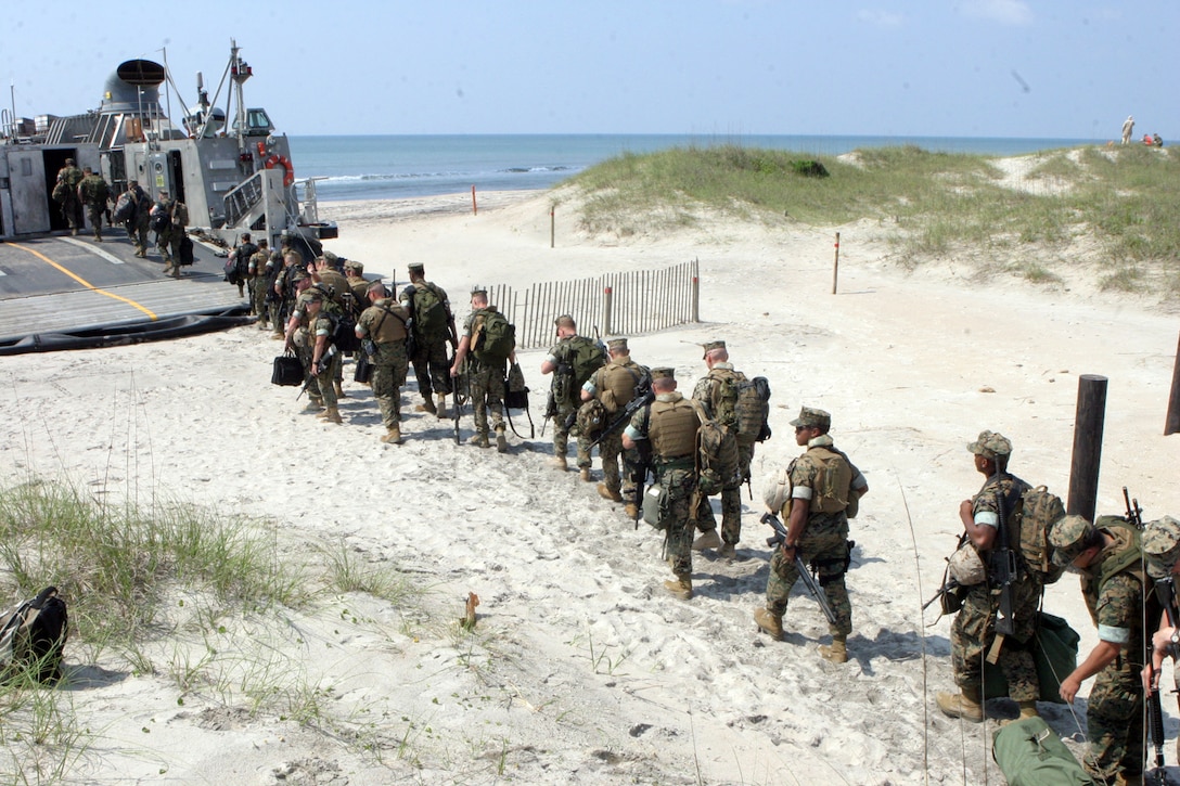 Marines from the 24th Marine Expeditionary Unit's (MEU) Command Element depart from Camp Lejeune, NC and board the USS Iwo Jima to kick off the MEU's 2006 - 2007 deployment. (US Marine Corps photo by Lance Corporal Andrew Carlson)