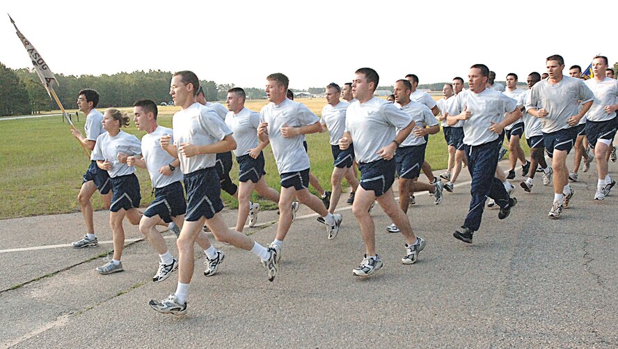 The 682nd Air Support Operations Squadron runs in unison while singing cadence during the early morning warrior run June 2.  The warrior run occurs the first Friday of every month.  (U.S. Air Force Photo/Tech. Sgt. Keri Whitehead)