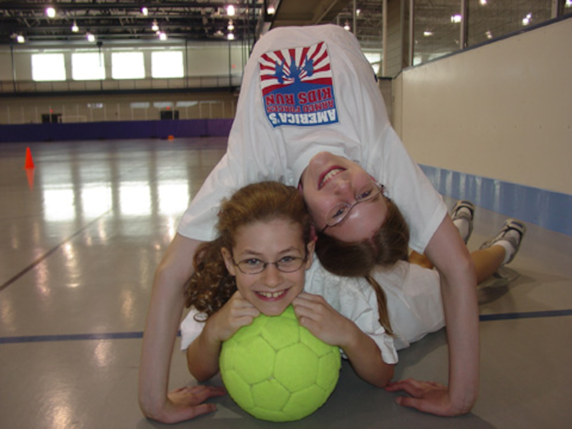 Base children, Rebekah (top) and Joanna Givens (bottom), were recently awarded the highest level in the FitFactor youth program. (Photo by Janessa Vageline)
