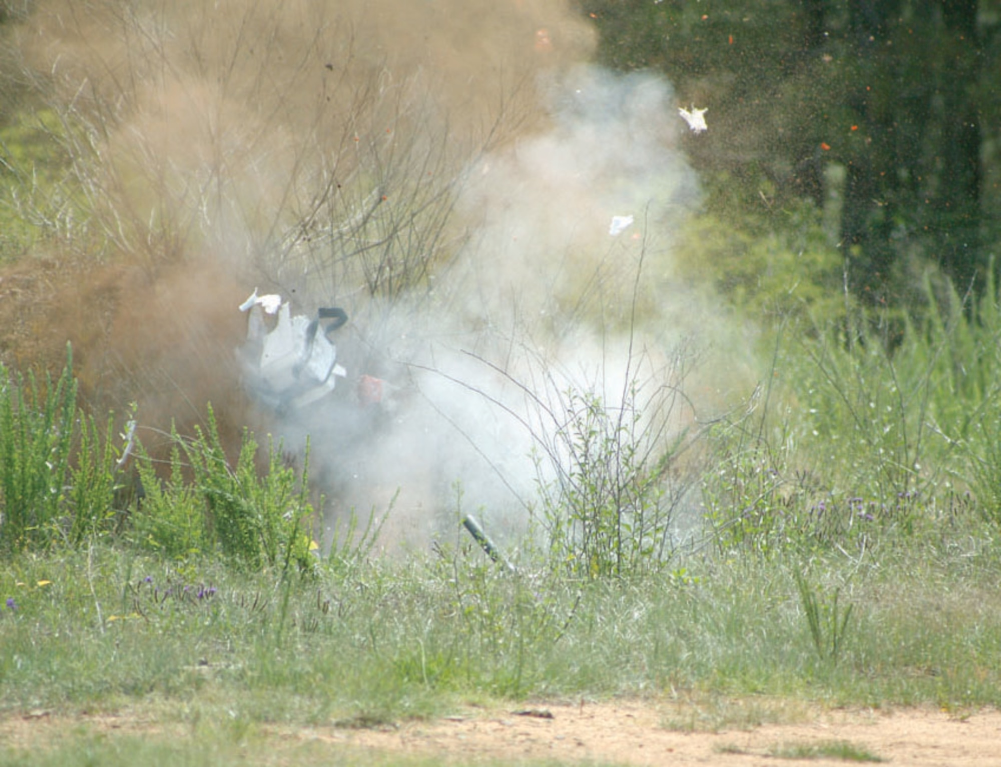 An EOD diruption tool causes an explosion in order to diarm the IED.   (U.S. Air Force Photo/Senior Airmen John Gordinier)