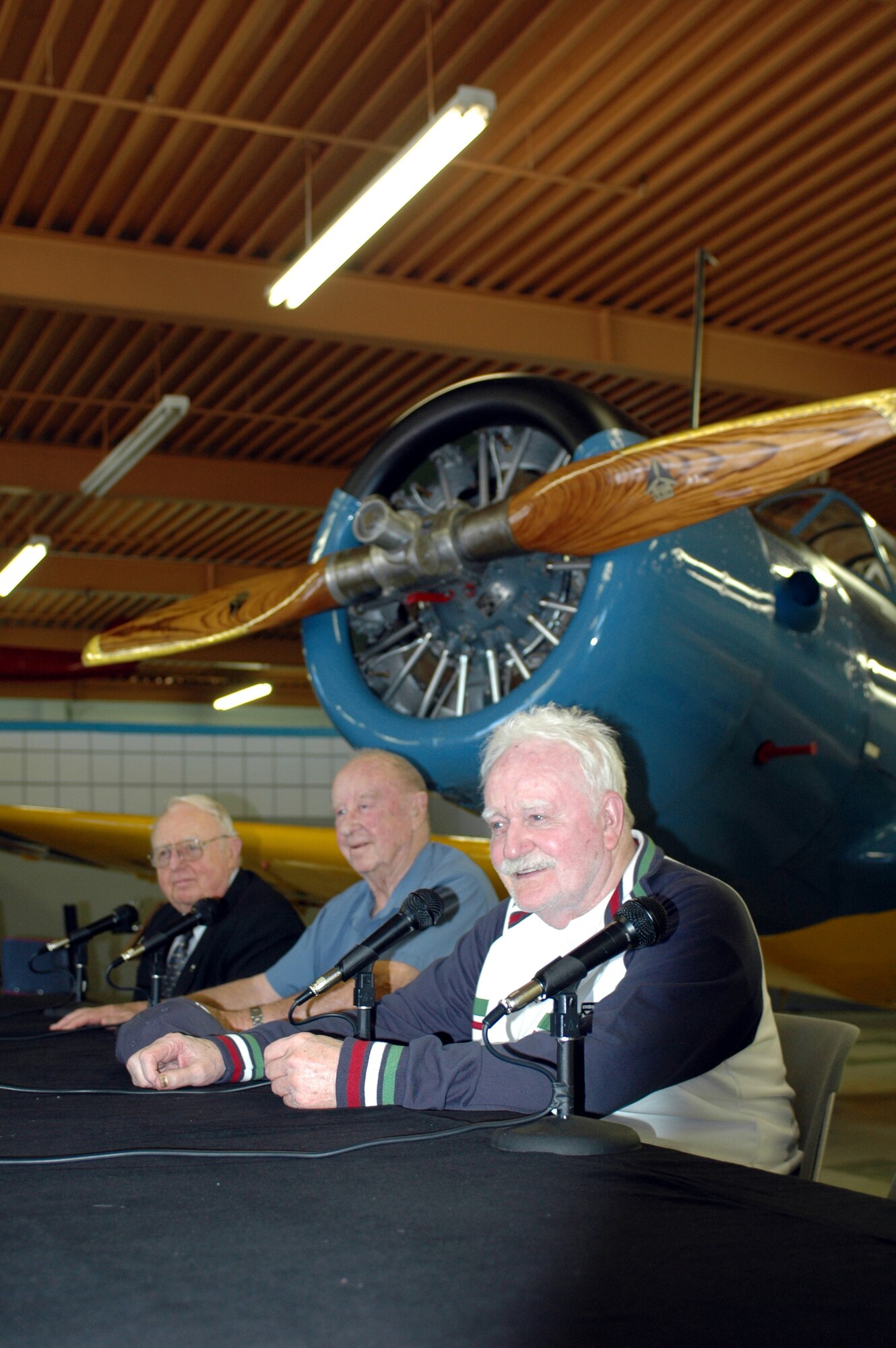 Retired Capt. Clayton Gross [left] retired Maj. Harold Comstock [middle] and retired Maj. Urban Drew  discussed in detail some of their first-hand dog fights and near death experiences at the  P-51 Mustang Aces Symposium at the Travis Air Museum Sunday. (U.S. Air Force photo/Staff Sgt. Matt McGovern)