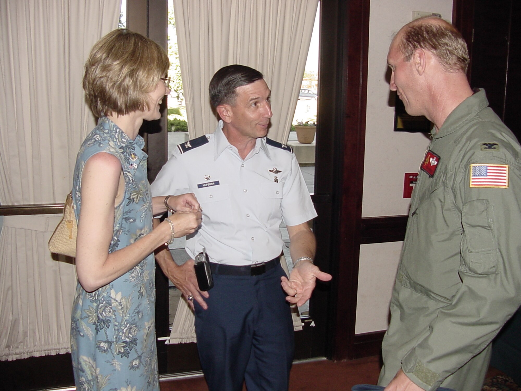 Col. Timothy Zadalis, 60th Air Mobility Wing vice commander, and his wife, Carol, congratulate Col. Byron Hepburn, 60th Medical Group commander, on his recent selection to brigadier general at the Delta Breeze Club Friday. Under his leadership, the David Grant USAF Medical Center operates the second largest readiness platform in the Air Force and the largest in Air Mobility Command with more than 1,700 deployable personnel assigned to mobility positions. (U.S. Air Force photo/Jim Spellman)
