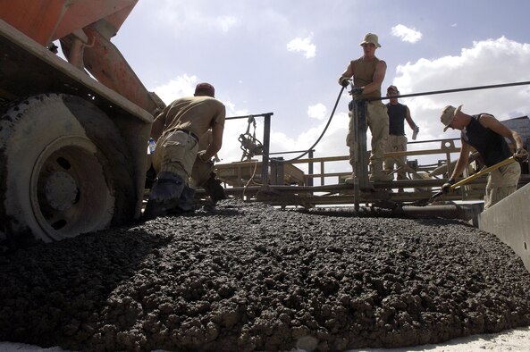 Members of the 1st Expeditionary Red Horse Group, Bagram, Afghanistan, pour concrete for a new ramp here June 5, 2006.  The ramp will provide support for close air support aircraft, such as the A-10 Thunderbolt II. (U.S. Air Force photo/Senior Airman Brian Ferguson)
