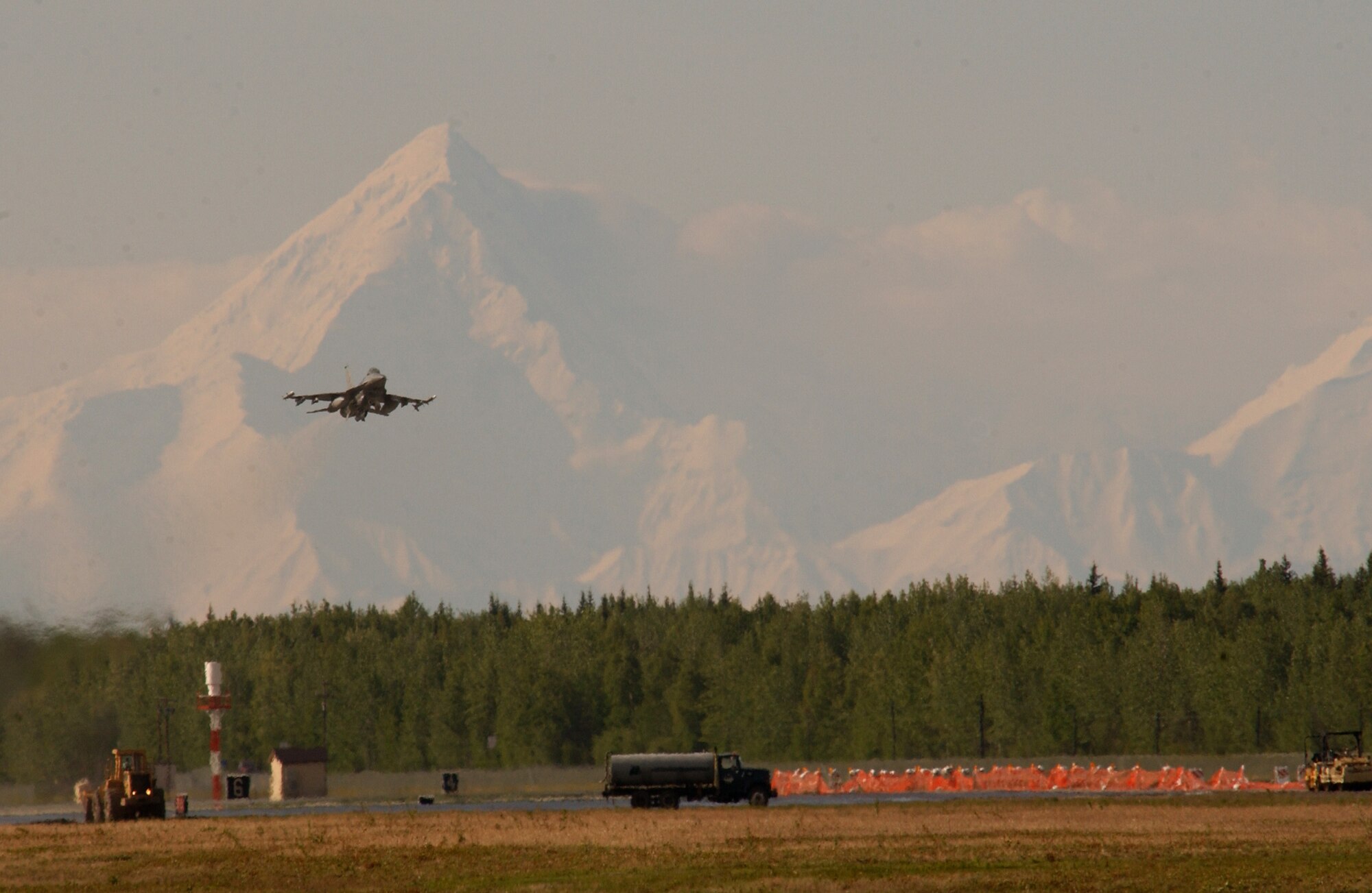 An F-16 Fighting Falcon from the 18th Fighter Squadron at Eielson Air Force Base, Alaska, takes off on Tuesday, June 6, 2006, during exercise Northern Edge 2006. The joint training exercise hosted by Alaskan Command is one of a series of U.S. Pacific Command exercises that prepare joint forces to respond to crises in the Asian Pacific region. (U.S. Air Force photo/Staff Sgt. Joshua Strang) 