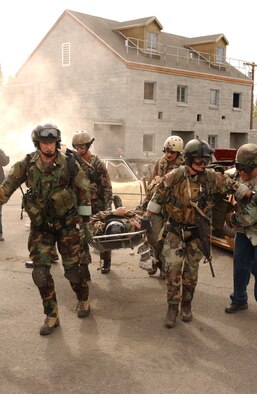 Airmen with the 31st Rescue Squadron at Kadena Air Base, Japan, transport simulated victims during a Northern Edge combat search and rescue mission at Fort Wainwright, Alaska, June 6, 2006. (U.S. Air Force photo/Staff Sgt. Joshua Strang)
