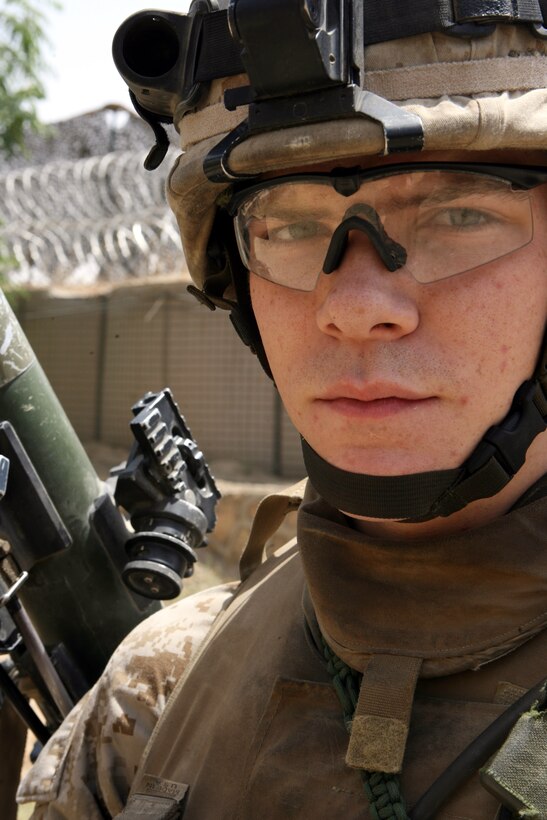 Lance Cpl. Richard M. Mason II serves as an assaultman for 2nd Platoon, Company K, 3rd Battalion, 8th Marine Regiment. Nicknamed the "Rocket Man," the 21-year-old from Medina, Ohio has effectively fired 24 rockets using the Shoulder-Launched Multi-Purpose Assault Weapon or SMAW during combat operations in Ramadi. The portable anti-armor rocket launcher has the sole purpose of destroying bunkers and other fortifications during assault operations.