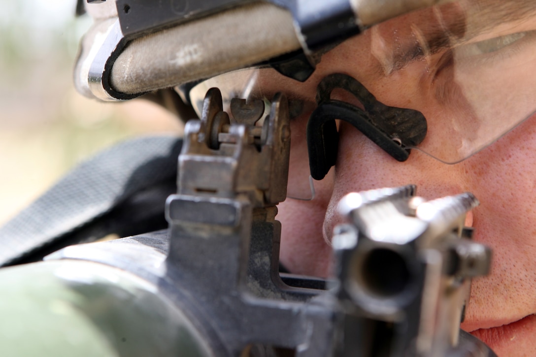 Lance Cpl. Richard M. Mason II, an assaultman for 2nd Platoon, Company K, 3rd Battalion, 8th Marine Regiment, prefers using iron sights when aiming on a target. Nicknamed the "Rocket Man," the 20-year-old from Medina, Ohio has effectively fired 24 rockets using the Shoulder-Launched Multi-Purpose Assault Weapon or SMAW during combat operations in Ar Ramadi. The portable anti-armor rocket launcher has the sole purpose of destroying bunkers and other fortifications during assault operations. 3/8 is currently deployed with I Marine Expeditionary Force (Forward) in support of Operation Iraqi Freedom in the Al Anbar province of Iraq to develop the Iraqi Security Forces, facilitate the development of official rule of law through demographic government reforms, and continue the development of a market based economy centered on Iraqi reconstruction.   USMC photo by Cpl. Joseph DiGirolamo  060610-M-0008D-003
