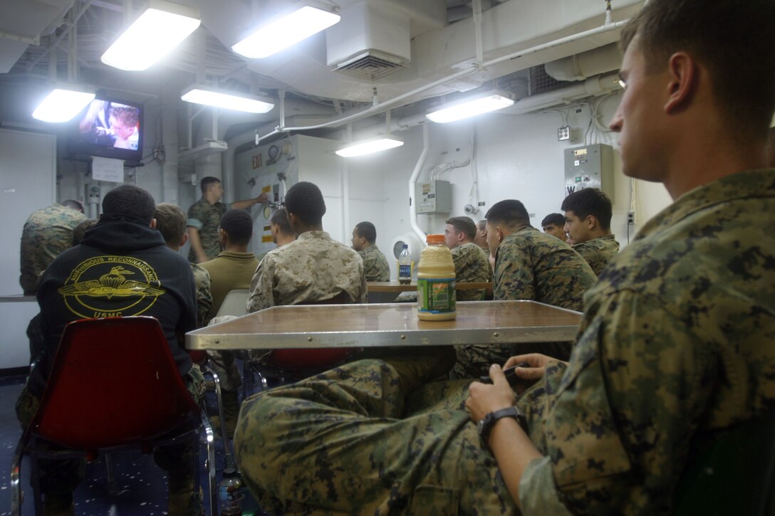 ABOARD THE USS BOXER,  (June 10, 2006) -- Marines with the 15th Marine Expeditionary Unit watch a boxing match while aboard the USS Boxer during the units 1st at sea training exercise. The 15th MEU has two more at sea training exercises sheduled before a deployment to the Western Pacific later this year.