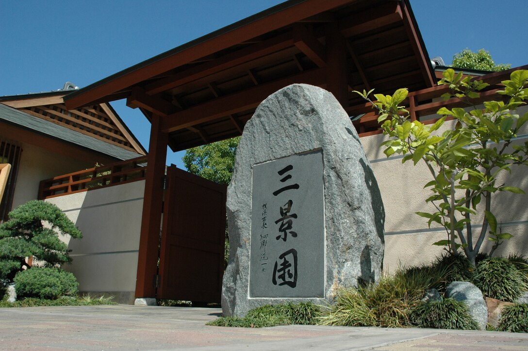 Inscribed with the kanji symbols ?San-Kei-En? or ?Three-Scene Garden,? the entrance stone to the San Diego Friendship Garden in Balboa Park welcomes visitors on a sunny afternoon June 11.