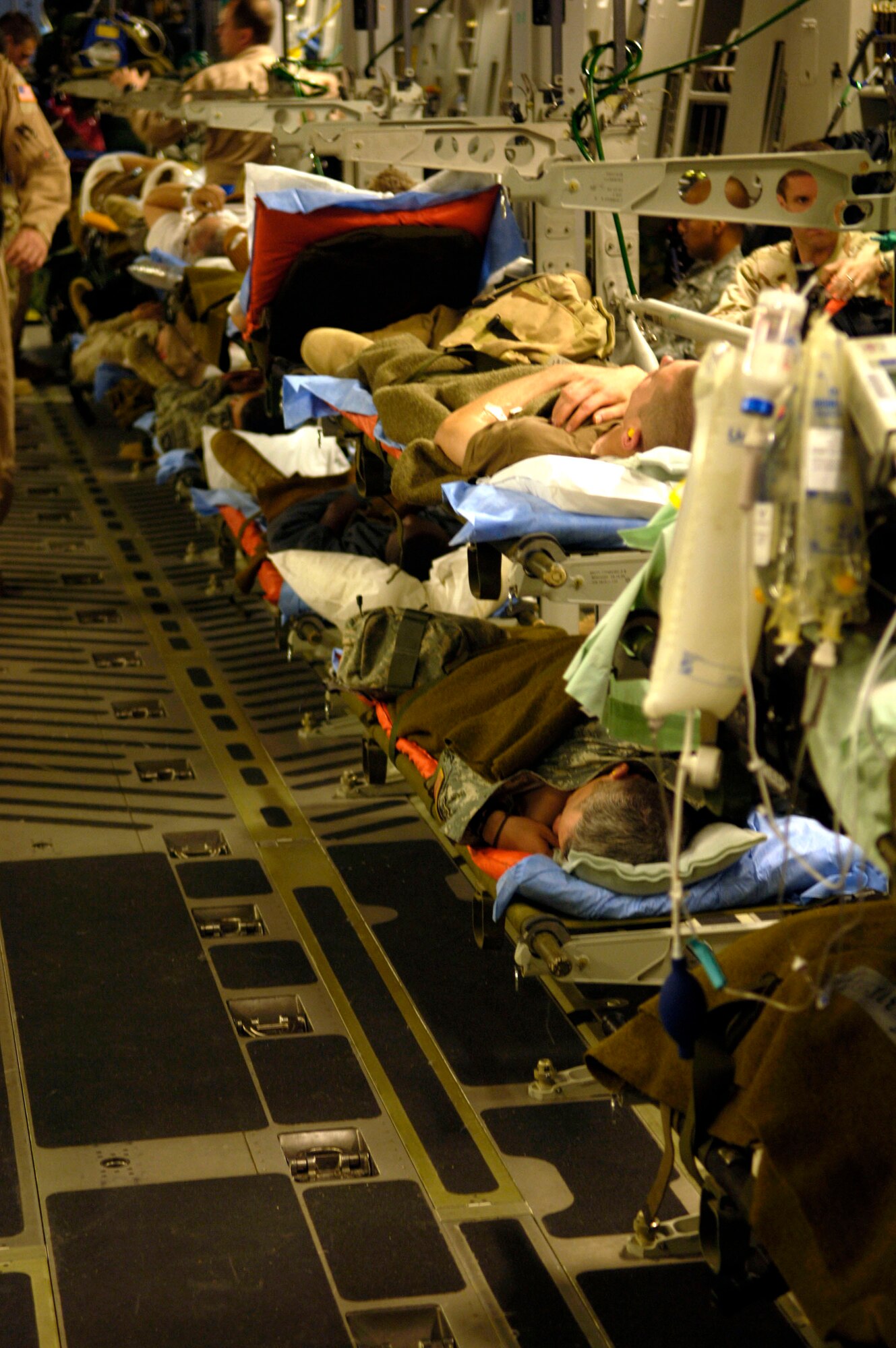 Final preparations are completed for wounded servicemembers about to be aeromedically evacuated from Balad Air Base, Iraq, on a C-17 Globemaster III on Friday, June 9, 2006. (U.S. Air Force photo/Airman 1st Class Andrew Oquendo)

