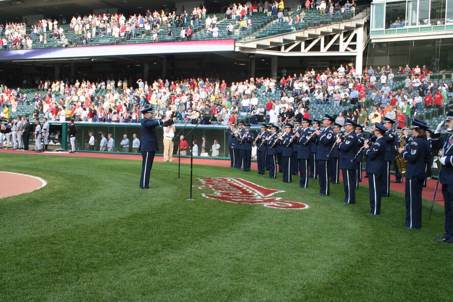 CLEVELAND— 2nd Lt. David Alpar, deputy commander and associate conductor, leads the U.S. Air Force Band of Flight in the national anthem at Jacobs Field June 1.  (Air Force photo by 1st Lt. Ellen Harr)

