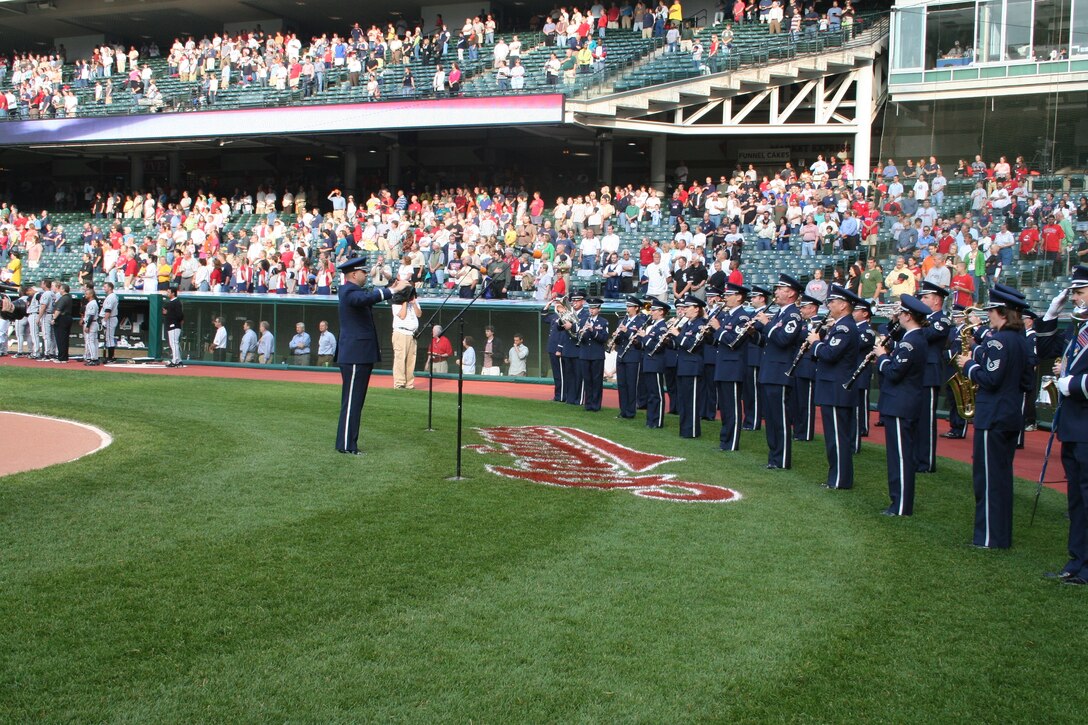 CLEVELAND— 2nd Lt. David Alpar, deputy commander and associate conductor, leads the U.S. Air Force Band of Flight in the national anthem at Jacobs Field June 1.  (Air Force photo by 1st Lt. Ellen Harr)

