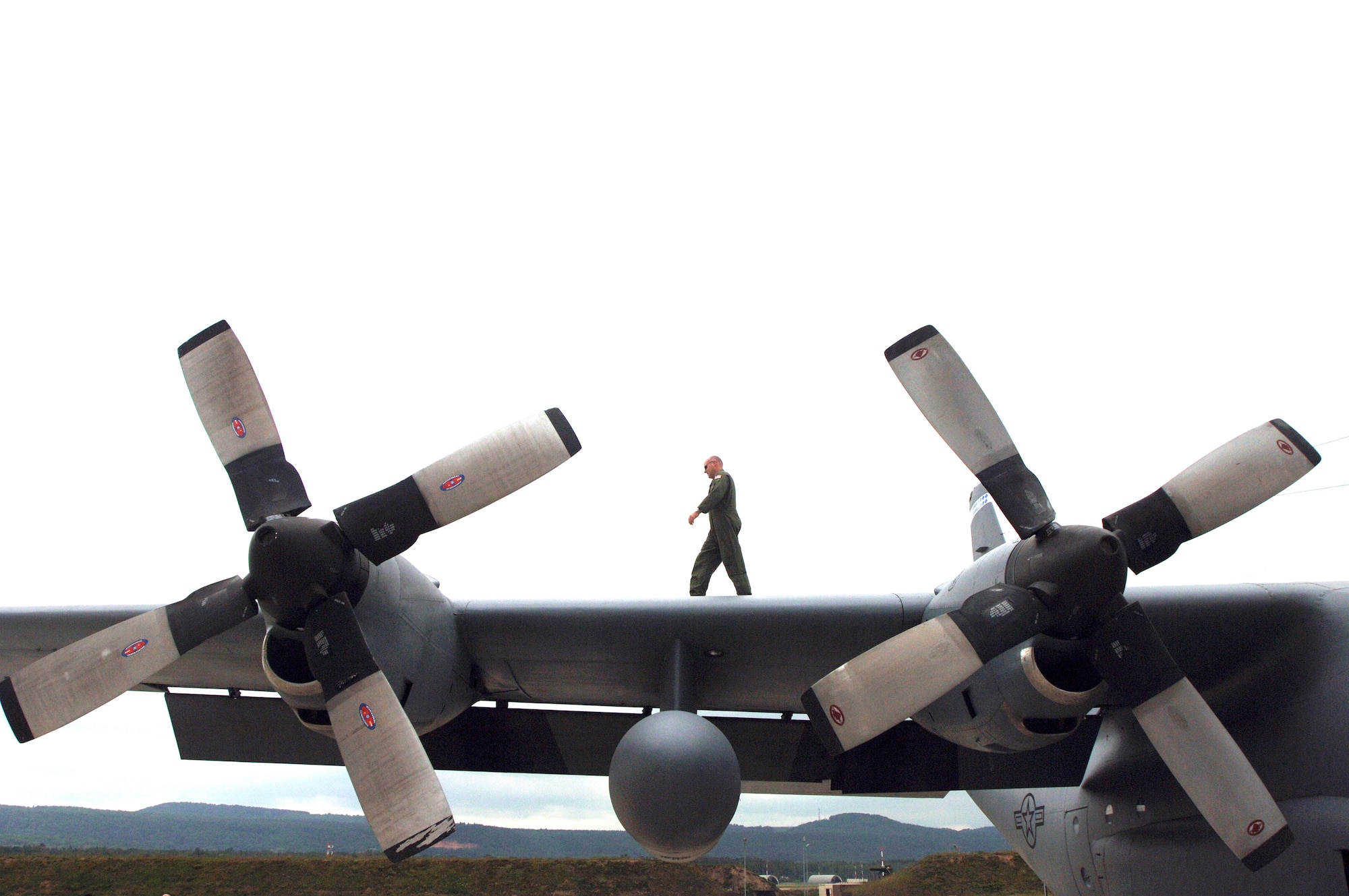 Tech. Sgt. Jeff McCombs walks the wing of a C-130 Hercules at Ramstein Air Base, Germany, on Monday, June 5, 2006. Sergeant McCombs is an aircraft engineer with the 37th Airlift Squadron. (U.S. Air Force photo/Master Sgt. John E. Lasky)
