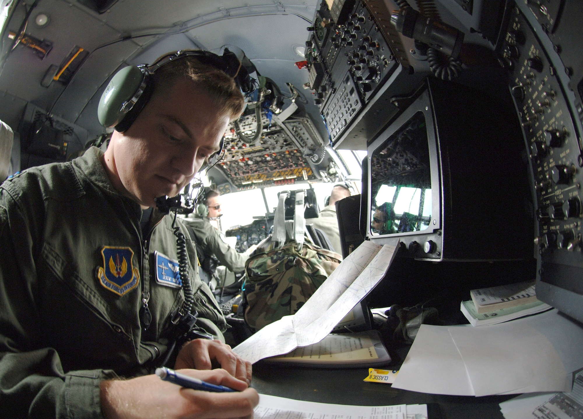 Capt. Jeremy Smith prepares the C-130 Hercules navigation system for the day's mission from Ramstein Air Base, Germany, on Monday, June 5, 2006. Captain Smith is a C-130 Hercules navigator with the 37th Airlift Squadron. (U.S. Air Force photo/Master Sgt. John E. Lasky)